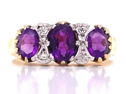 18ct Three Amethyst Four Diamond Ring image